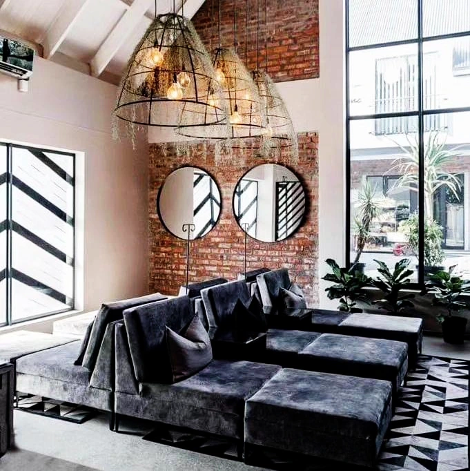 Seating, brick walls and pendant lights in the Port Elizabeth lounge